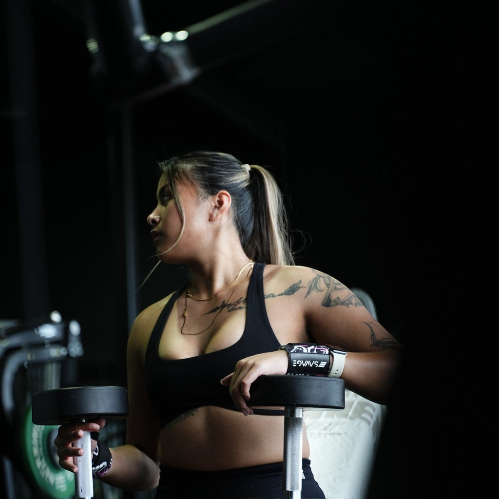 Woman exercising with dumbbells in a gym setting