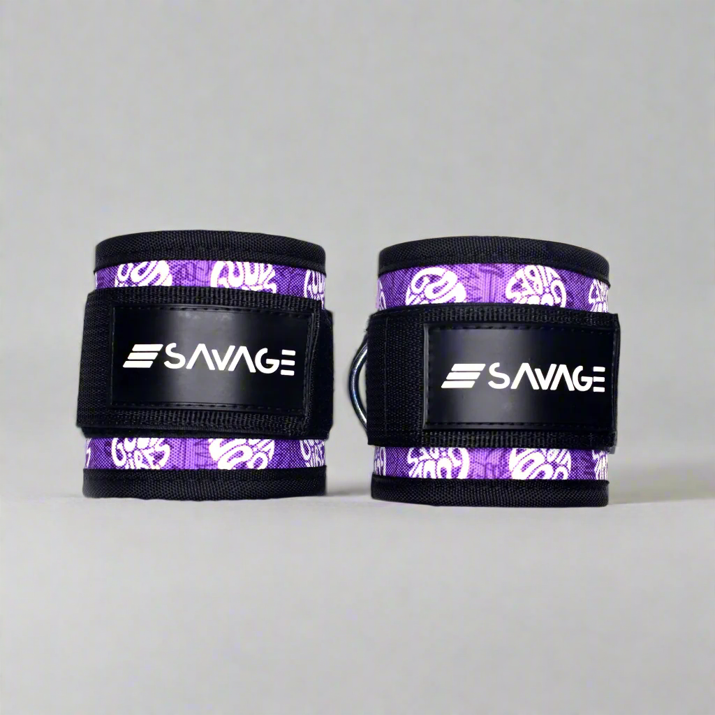 Pair of purple and black good vibe collection ankle straps with 'Savage' branding on a white background