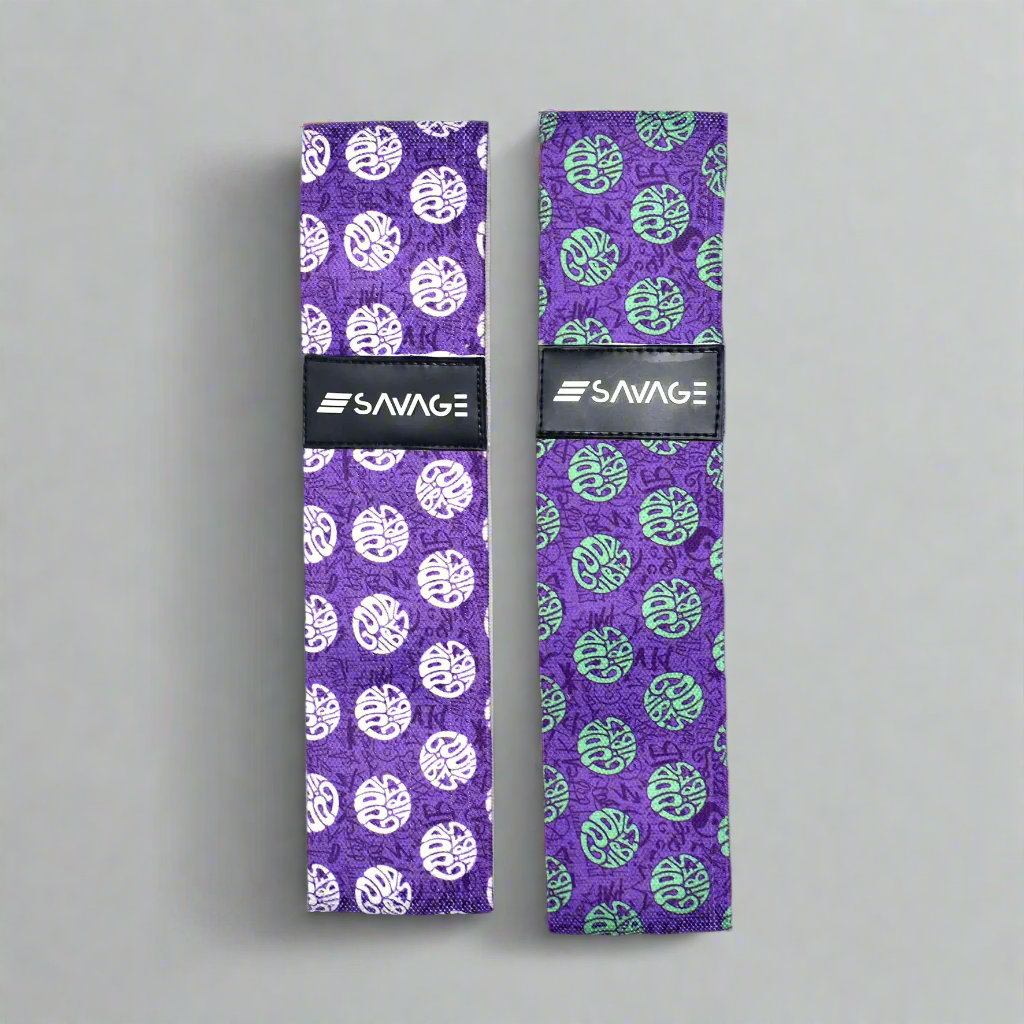 Two purple booty bands with white and green patterns on a purple background, featuring the Savage brand. good vibes collection
