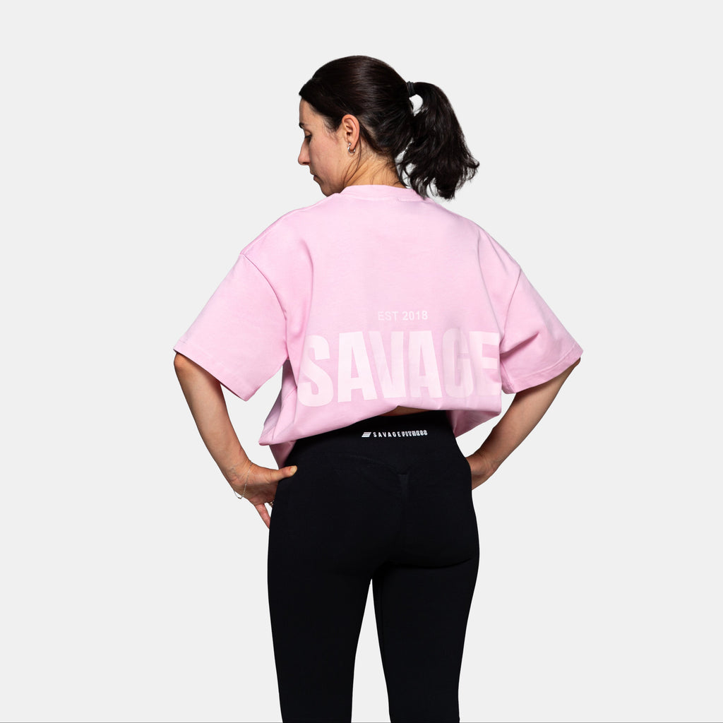 Savage Fitness oversized pink tee womens back view with large SAVAGE print