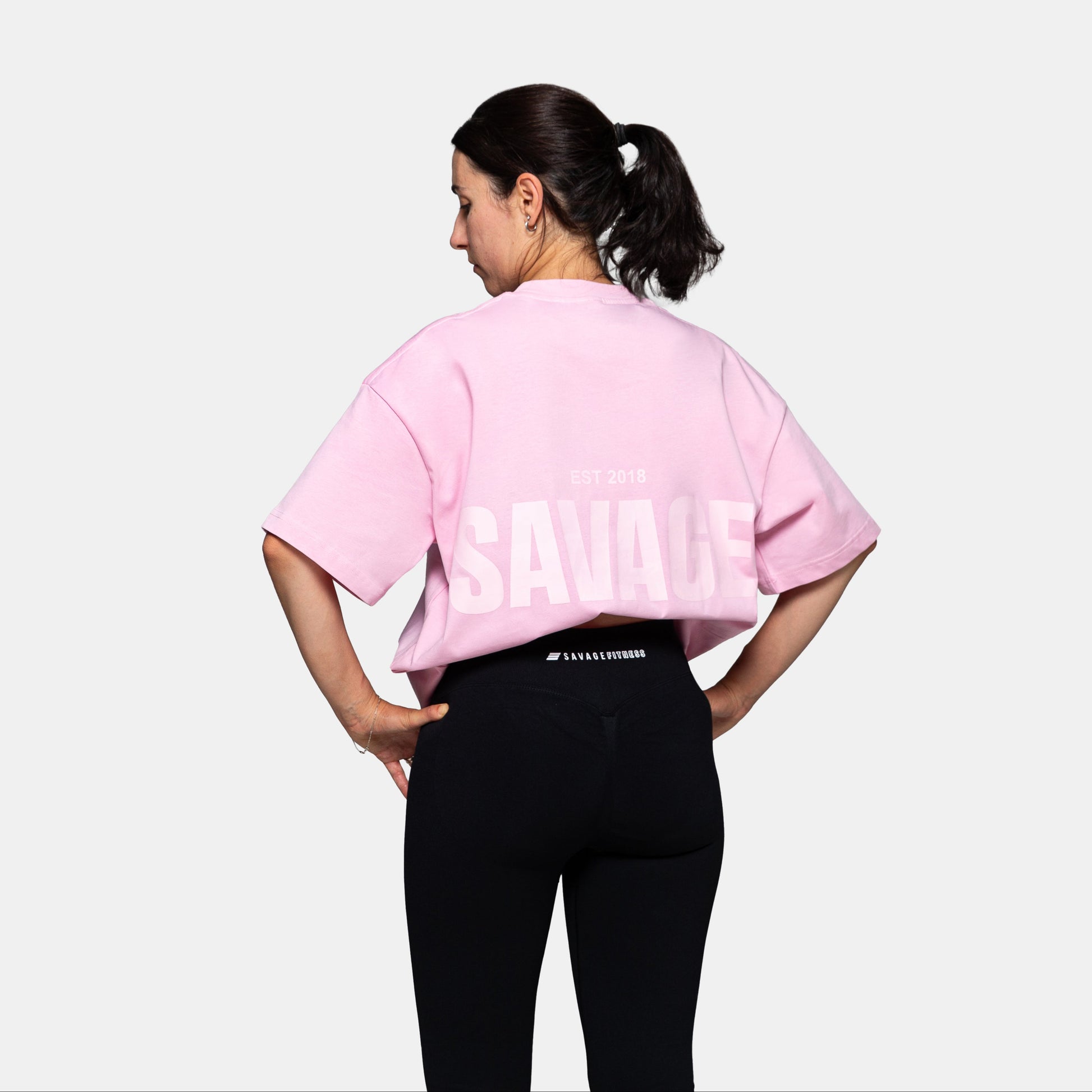 Savage Fitness oversized pink tee womens back view with large SAVAGE print